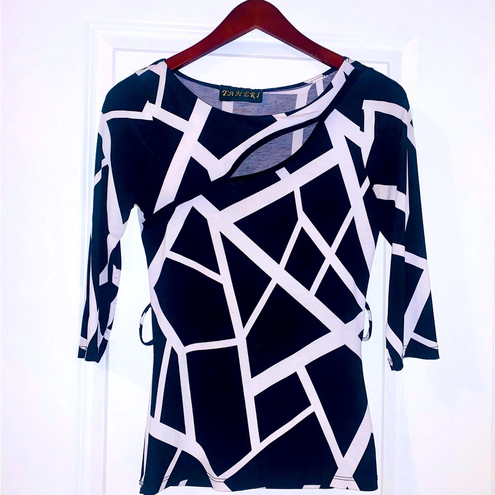 Boutique Size Small shirt that has cute cutout in the front.